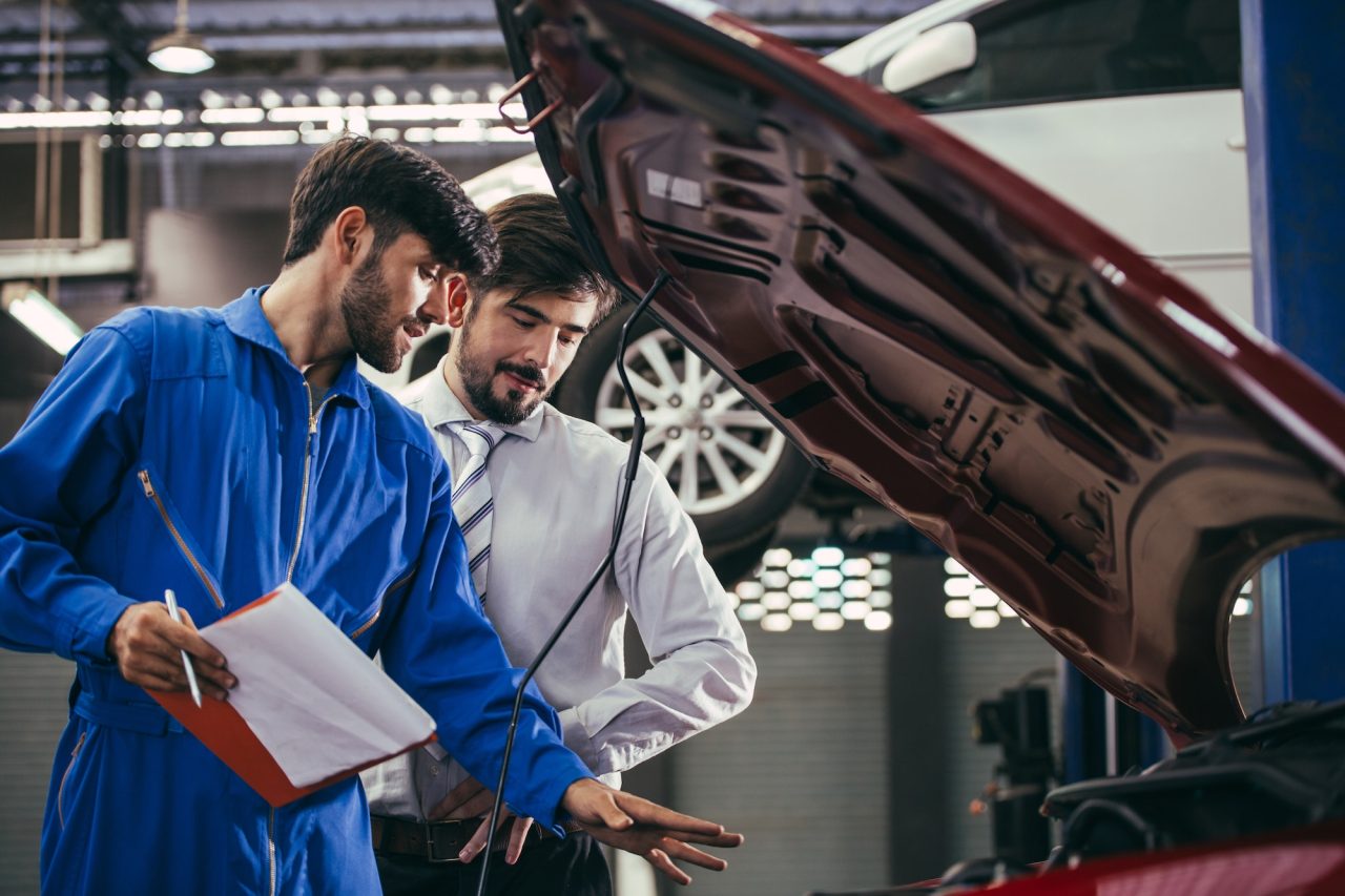 automotive-maintenance-mechanic-explain-repair-condition-to-customer.jpg